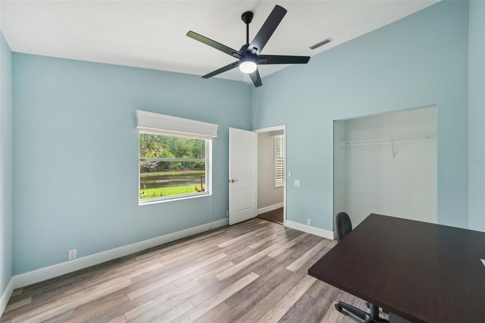 The guest suite is tucked away for added privacy and convenient to the full pool bathroom with direct access to the pool.