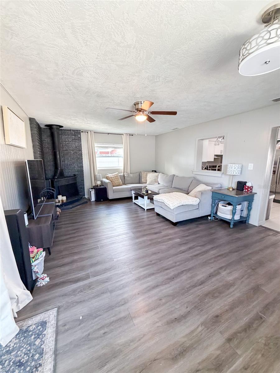 Large spacious family room with sliders to the screeend porch.