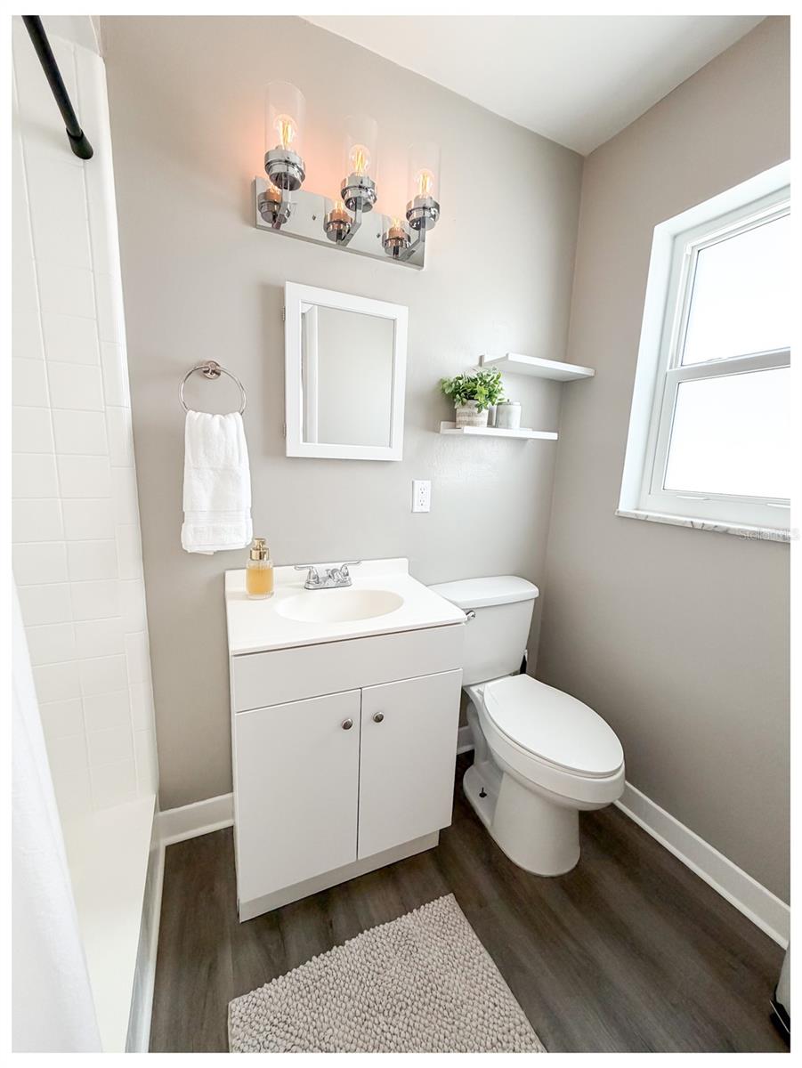 Primary ensuite with new vanityand lighting