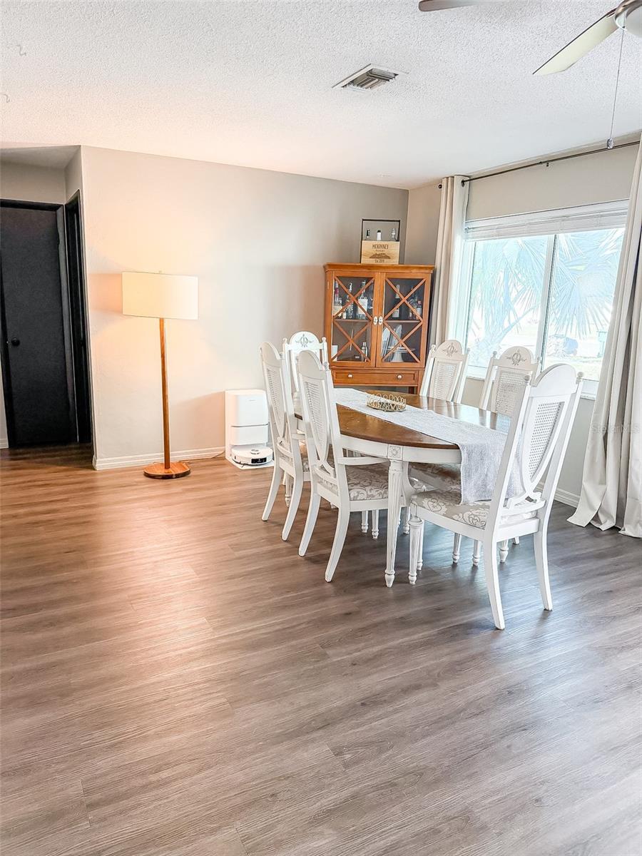 The current owners use this as their dining room, but it would also be a great room as a sitting room or formal living room.  Two bedrooms and the main bath are off this room.