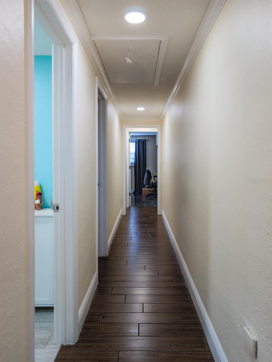 Long hall with 3 bedrooms