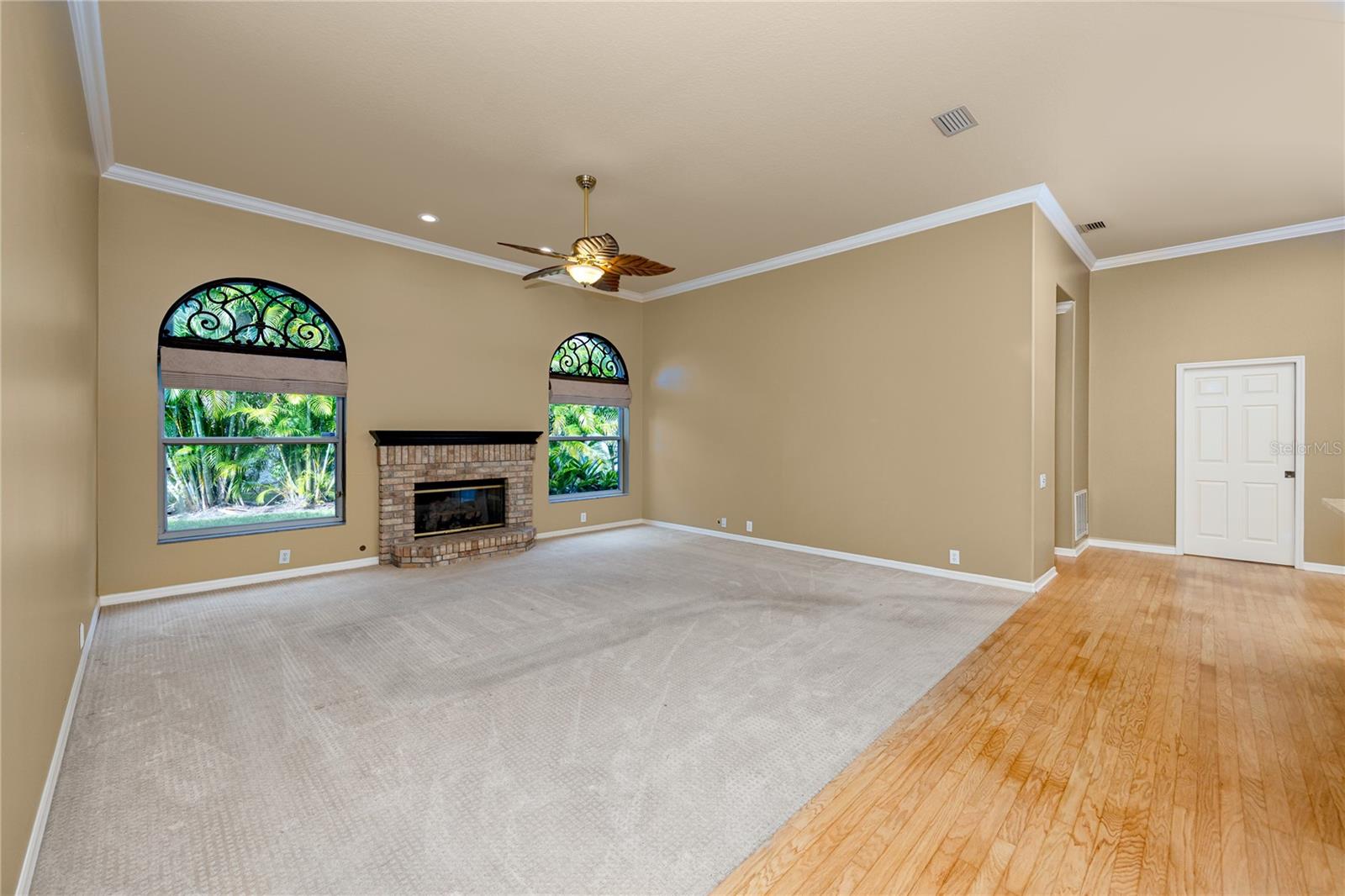 Family Room with Gas Fireplace and open to Kitchen · 1471 Briargrove Way Oldsmar FL 34677