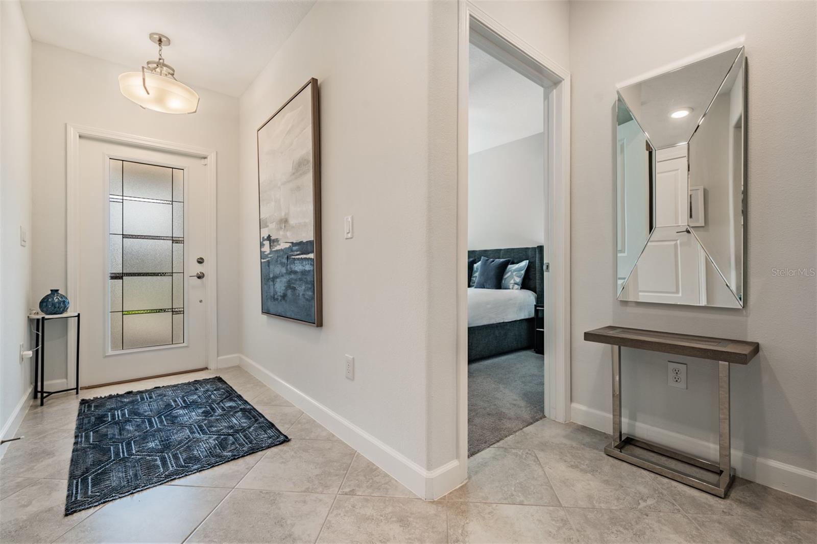 Foyer with leaded glass door adding natural light