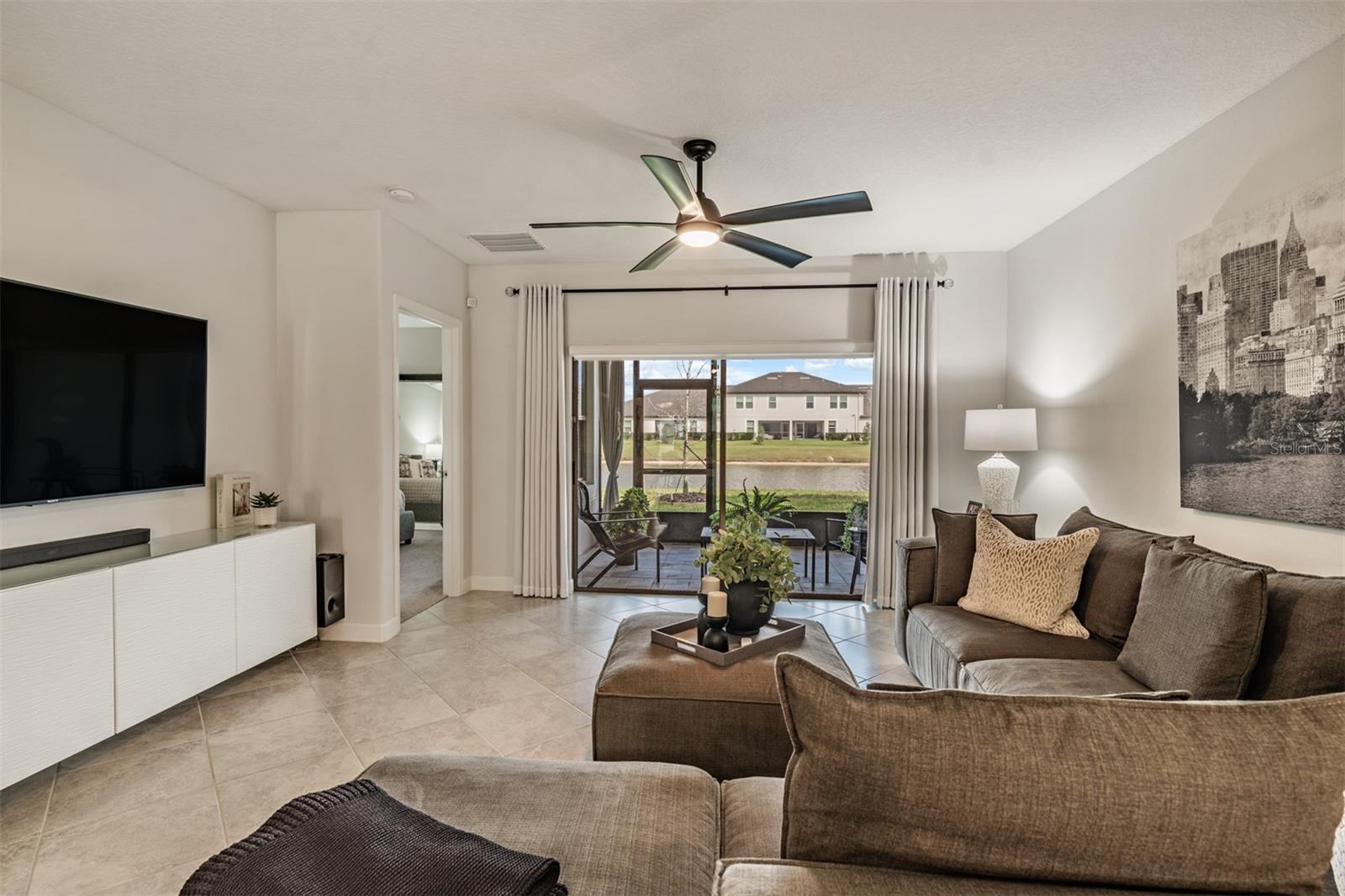 Electric shade with remote on sliding doors for privacy in greatroom!