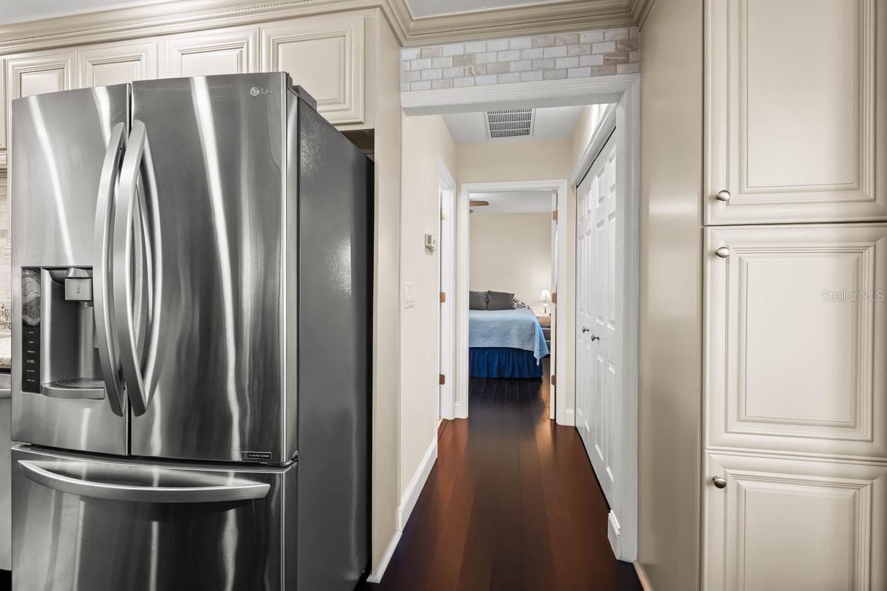 Hallway with the half bath and primary at the end.