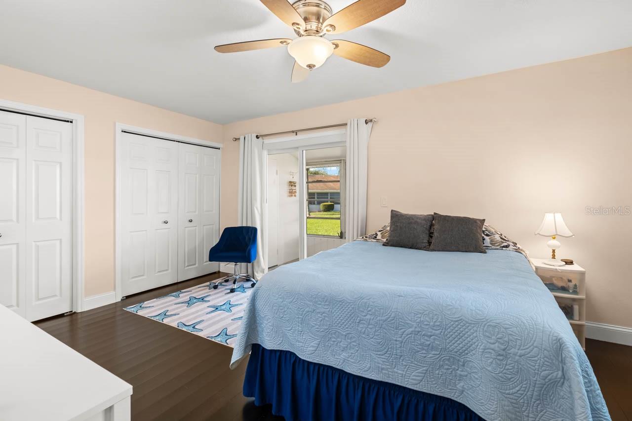 Primary bedroom with sliders to the porch