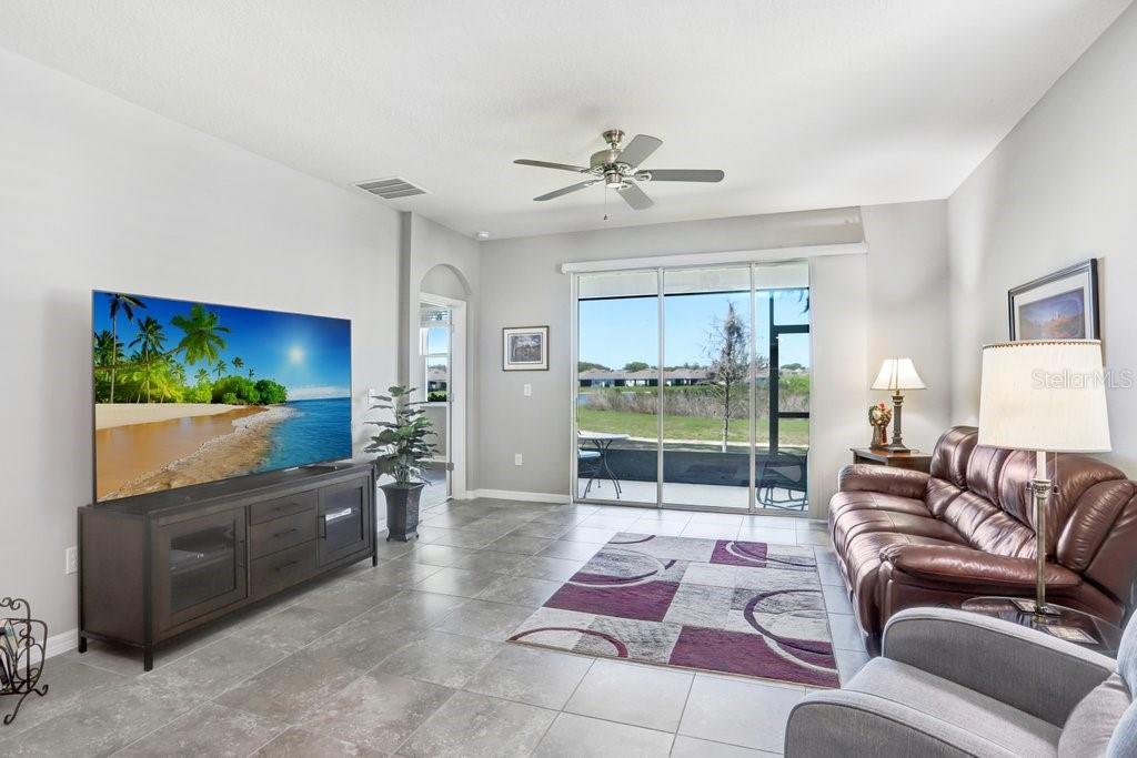 Triple sliders on the screened lanai add in natural light