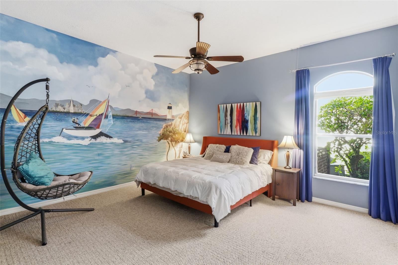 Spacious secondary bedroom featuring a walk-in closet and convenient access to the pool bath