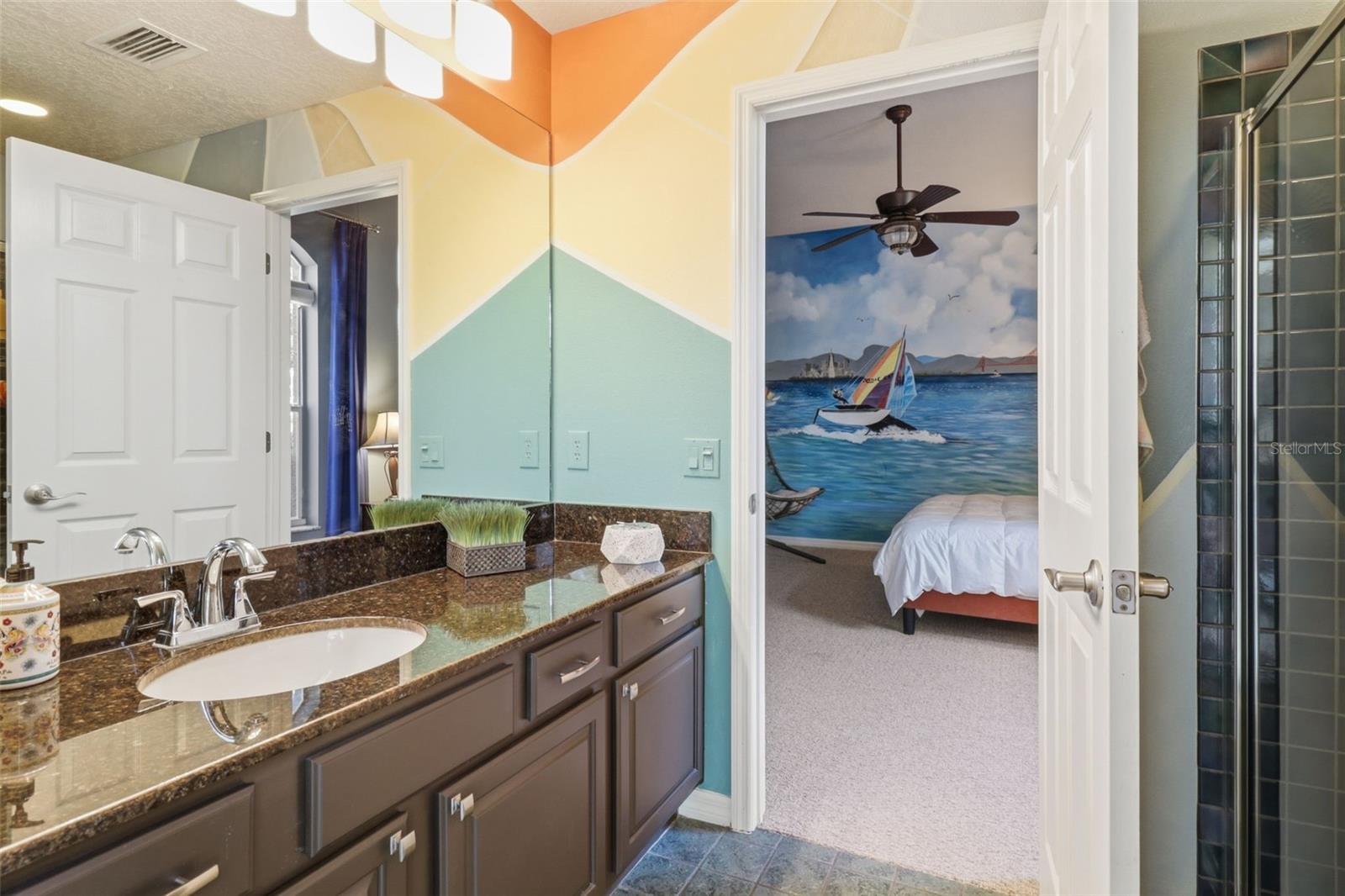 Stylish pool bath with walk-in shower—easily accessible from the bedroom and outdoor pool area