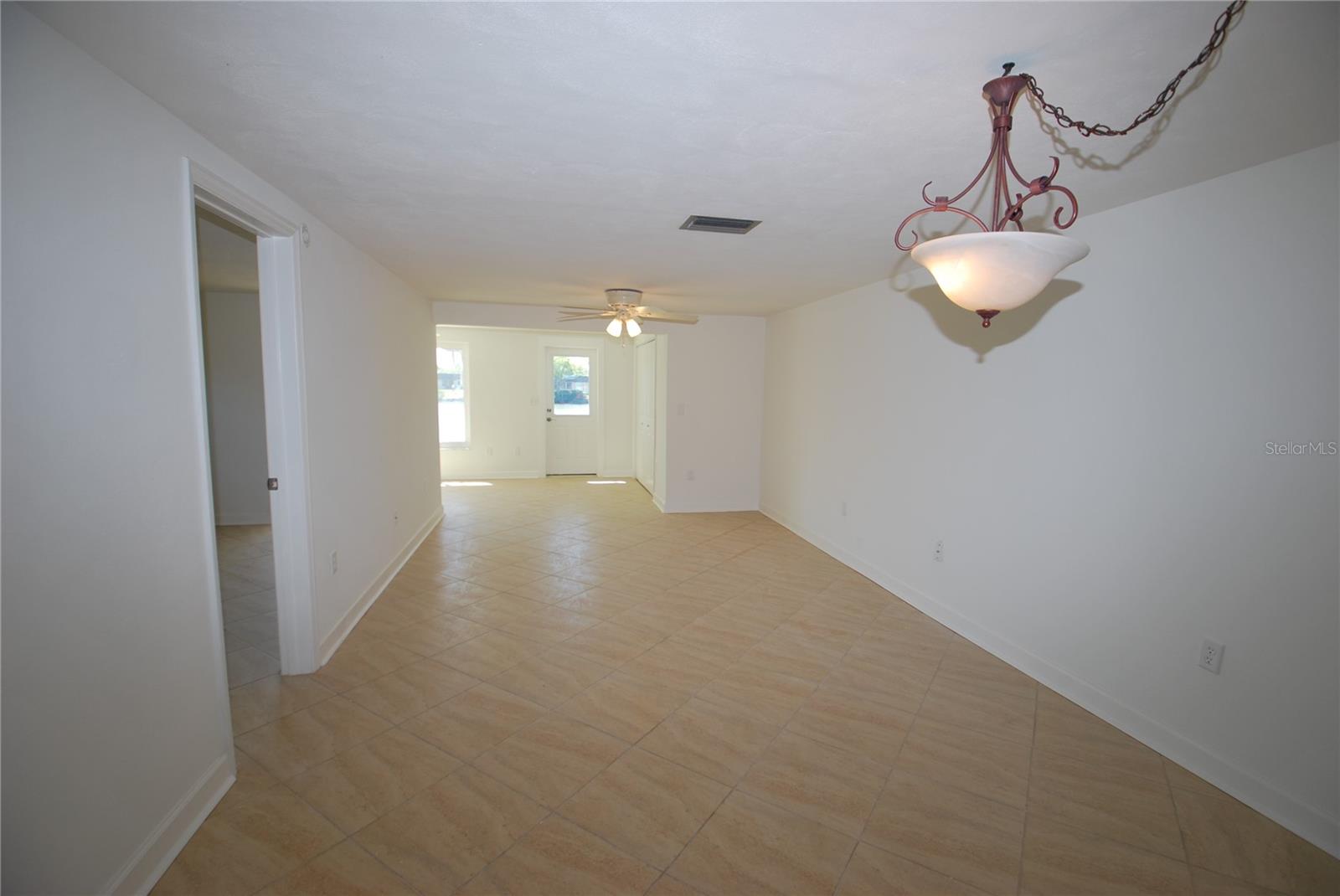 large family/dining room with all tile floors