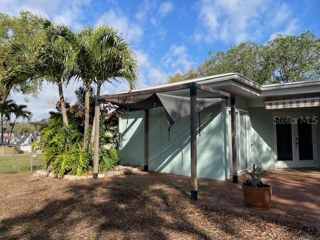 Pergola attached to brick paver patio