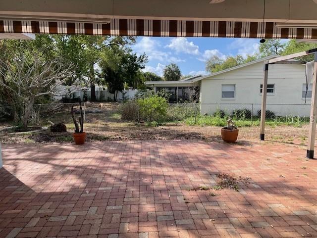 back patio with roll out full size canvas awning