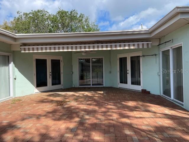Doors on left go to Living Room, Middle set goes to hallway, 2 sets of doors on right enter into Primary Owner's suite
