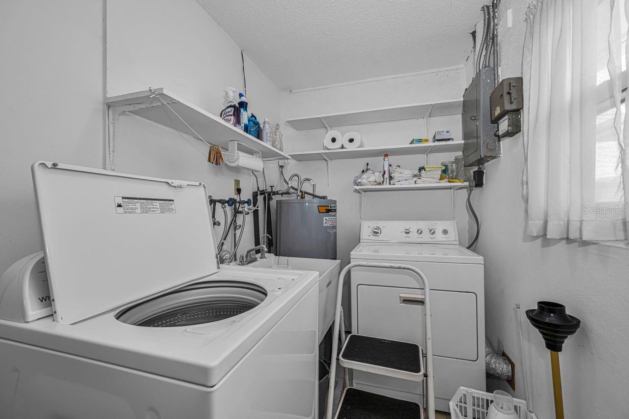 Laundry is located just inside the garage for easy access.
