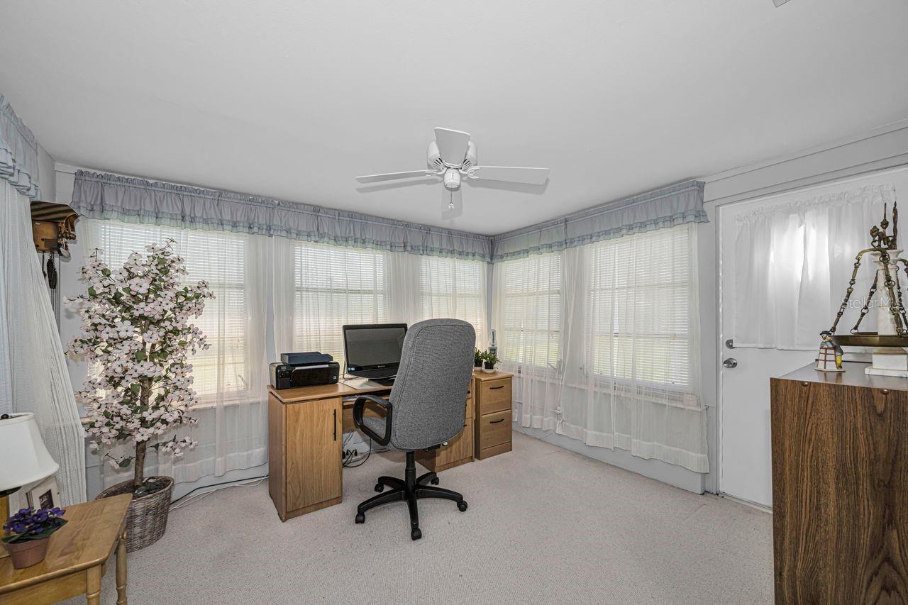 This sunroom offers so many options and leads to the rear yard.