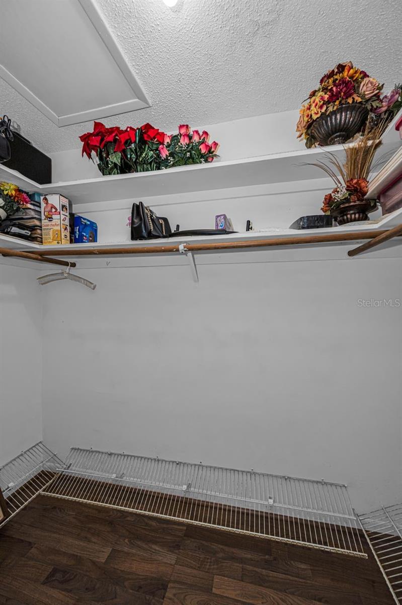 Primary bedroom walk-in closet