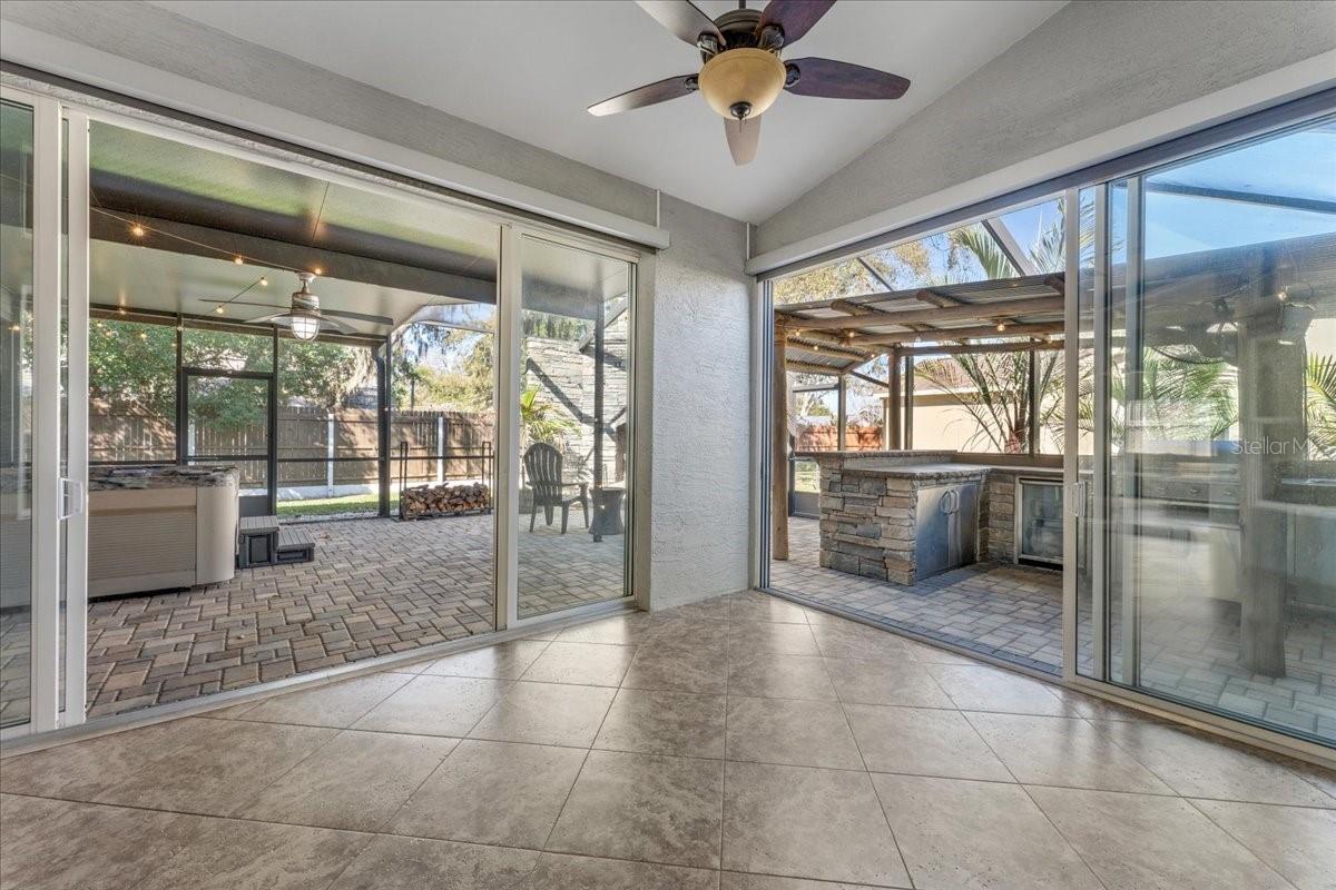 Amazing sunroom that looks out over your own tropical getaway .