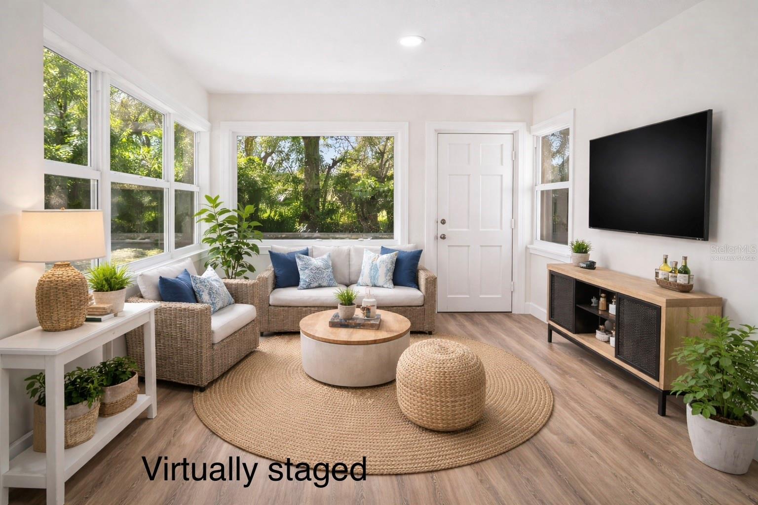 Sunroom with door to backyard - Virtually Staged