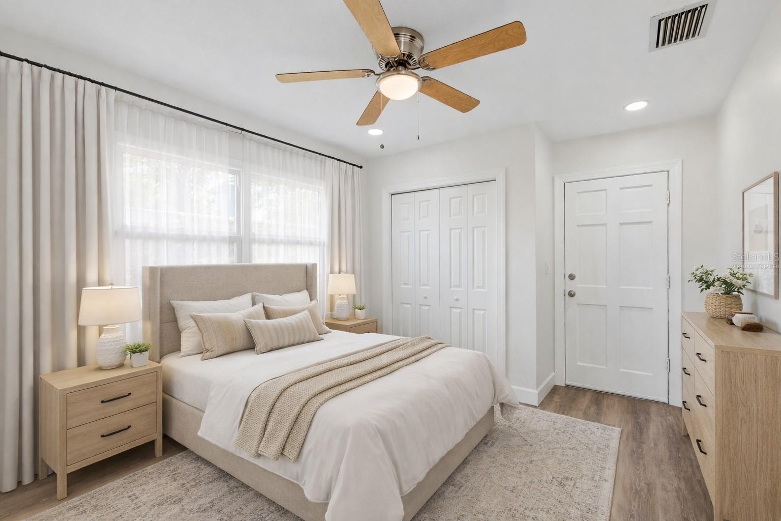Third Bedroom with door to screened in lanai - Virtually Staged