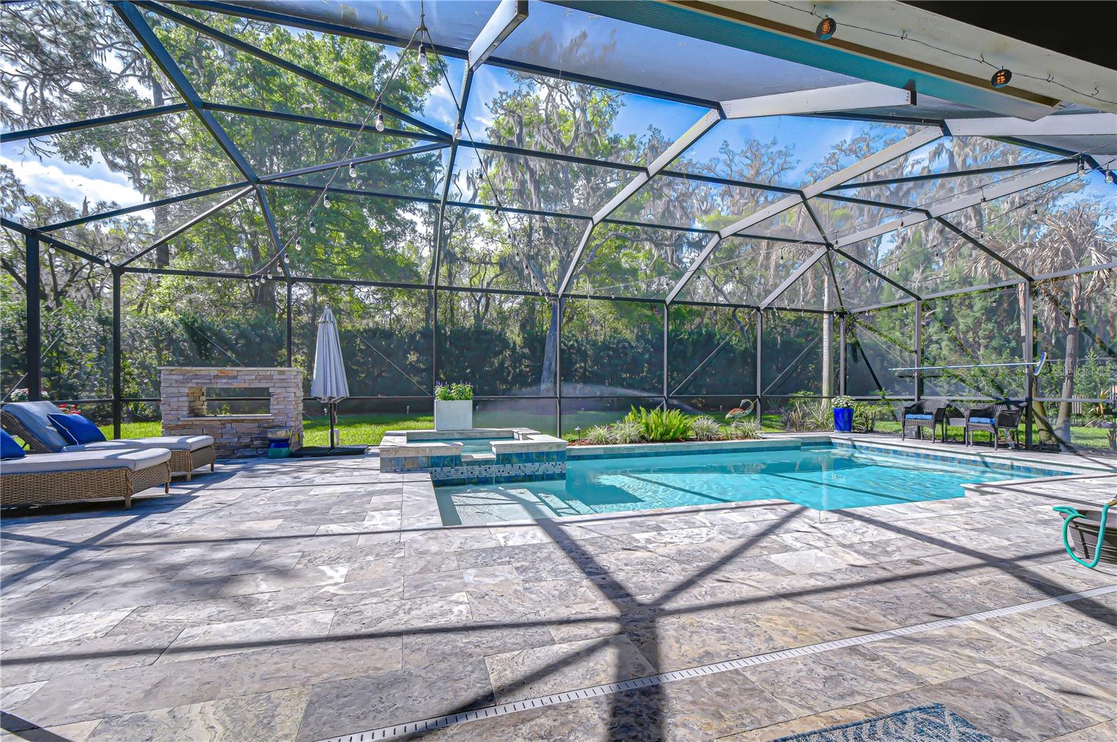 Resort-style outdoor space overlooking a peaceful preserve.