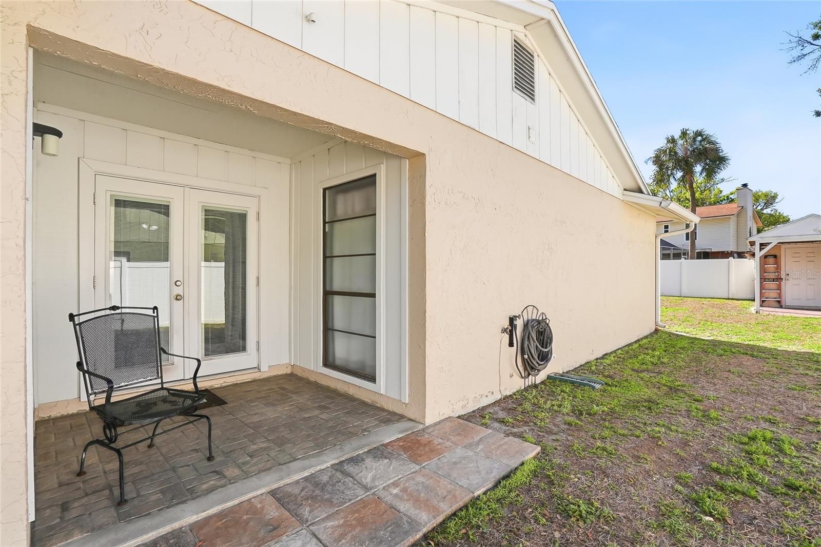 French doors that lead from the Kitchen