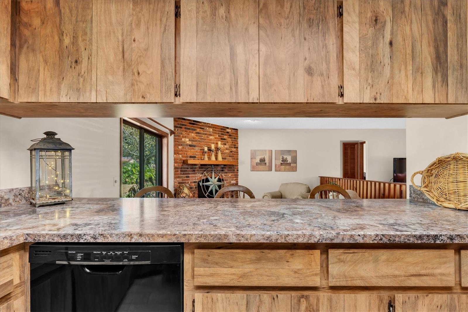 Kitchen has tiled floors and black appliances including Dishwasher, Microwave, Range, and Refrigerator