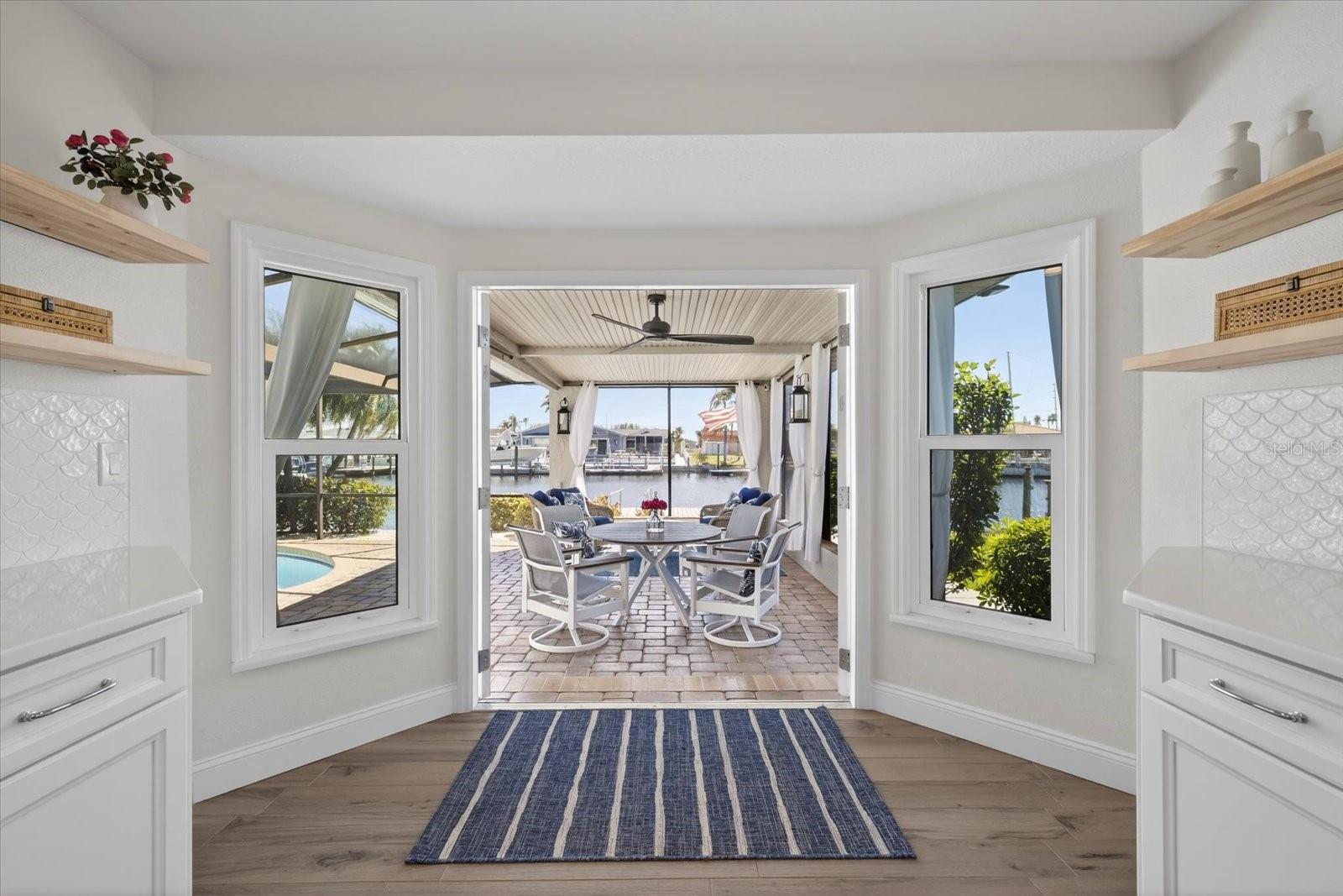 Large kitchen opens to outdoor seating area