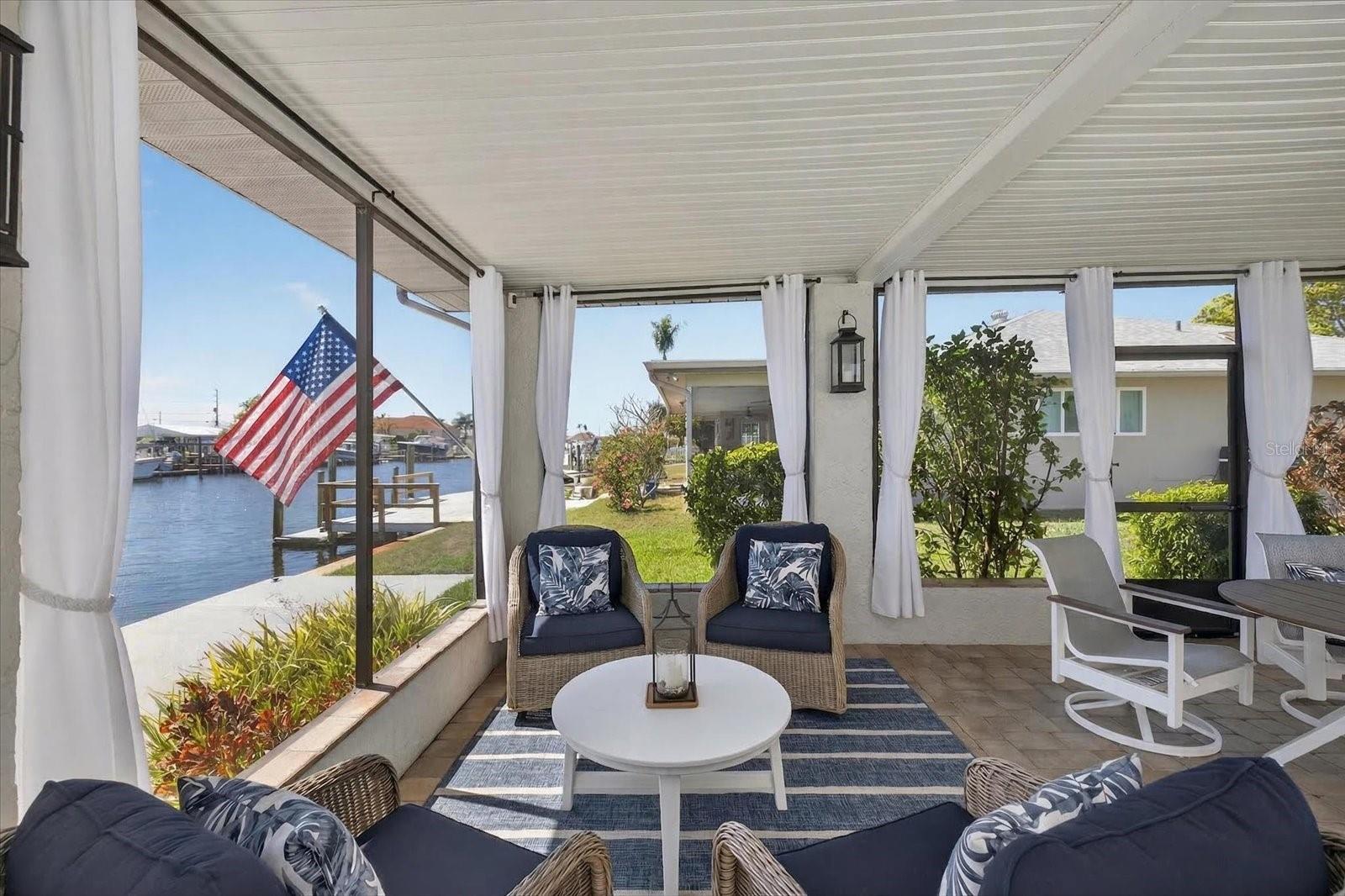 Screened in and covered outdoor living area/poolside