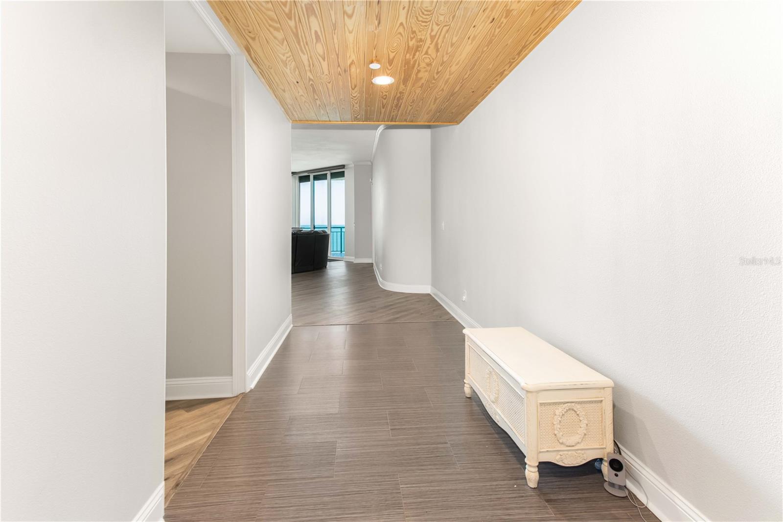 Gorgeous entryway featuring beautifully finished wood plank ceilings
