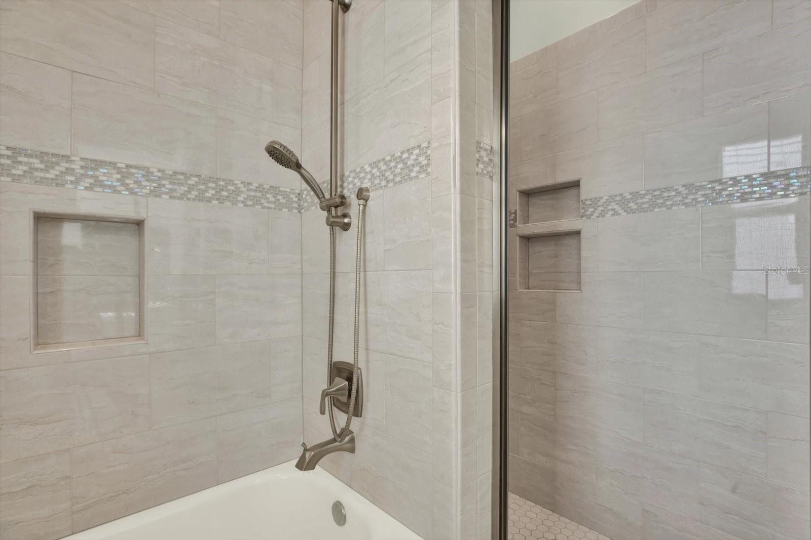 Ensuite bathroom has a walk-in shower and tub.