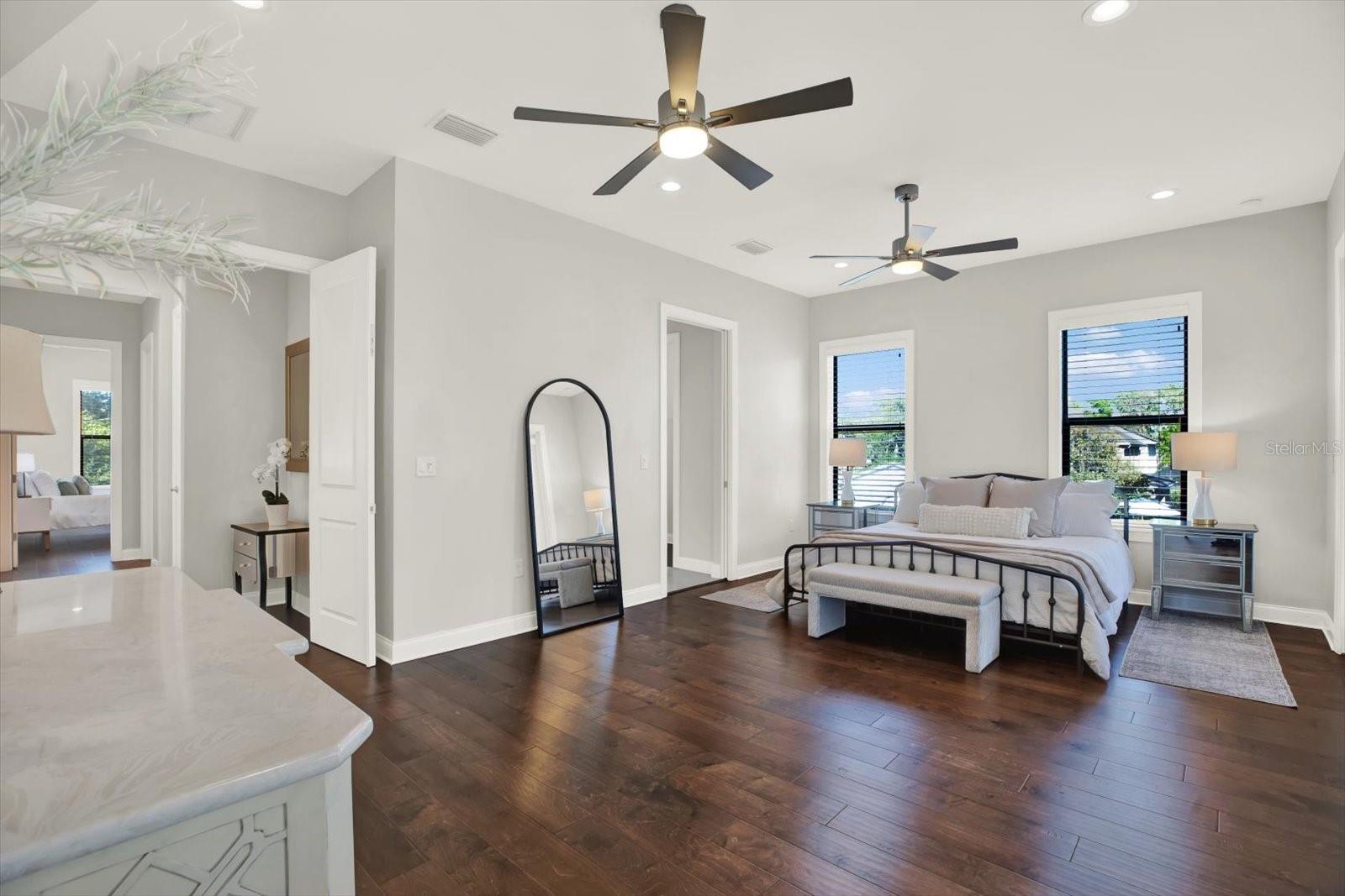 Primary oversized bedroom with dual closets.