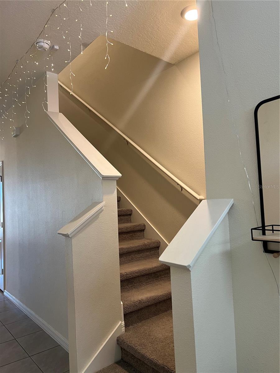 Stairway leading to Loft Area and Laundry Closet