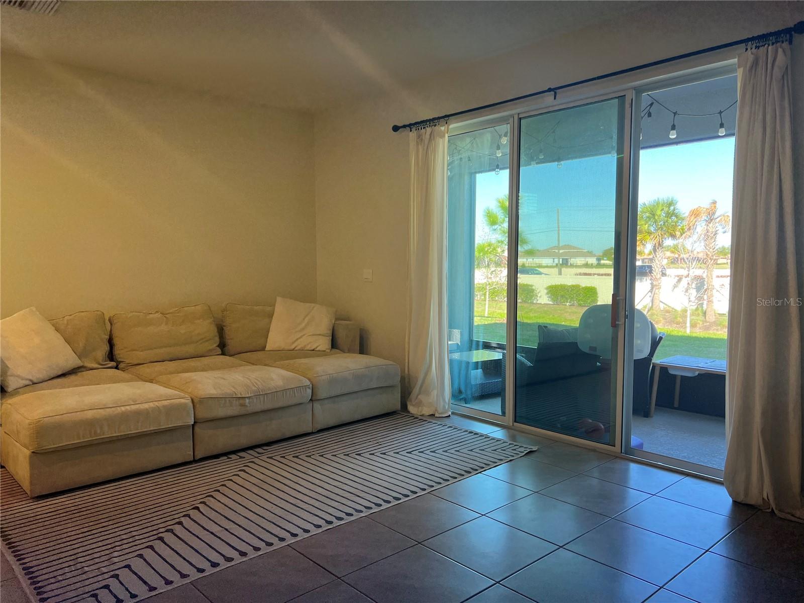 Living Room with access to the Enclosed Patio