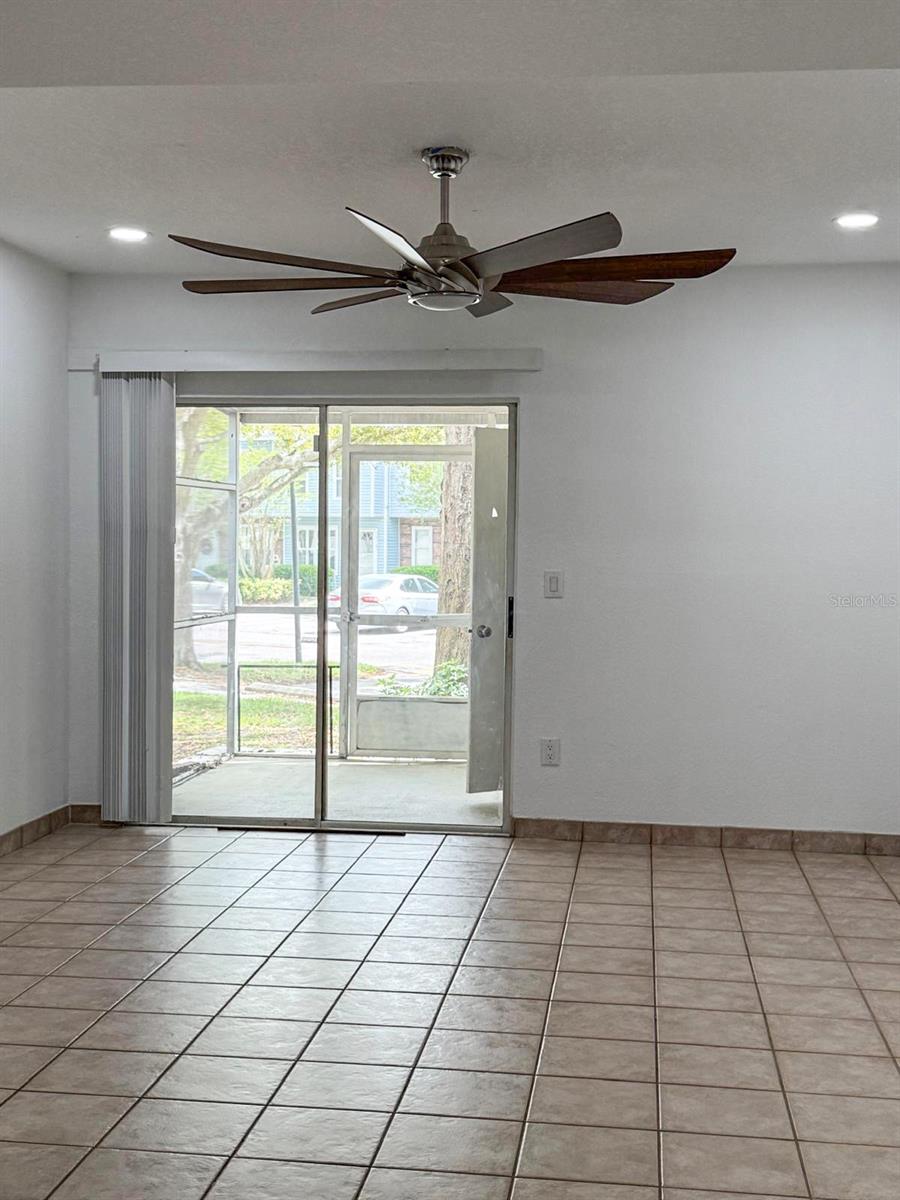 Spacious living room with big oversized fan