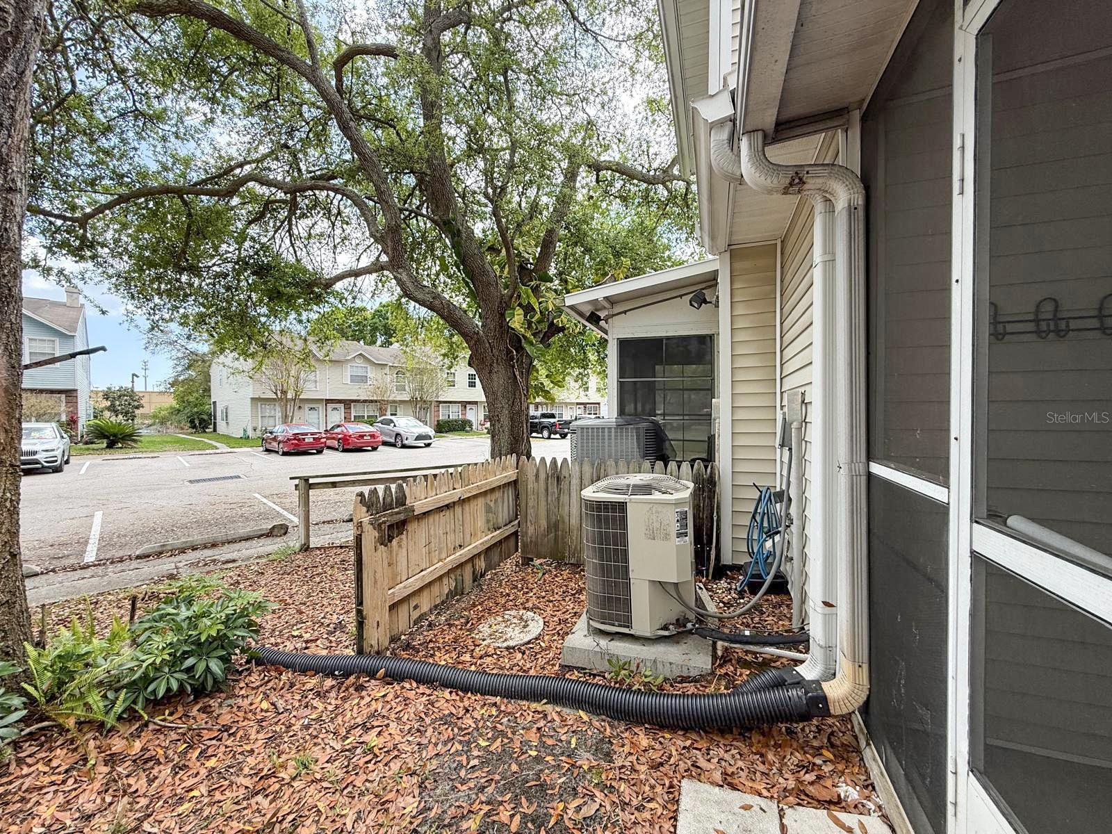 A/C in back yard off of screened in porch.