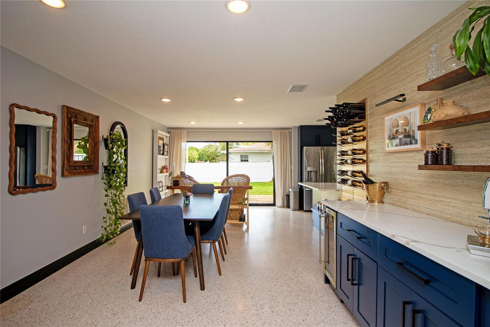Dining area with service counter/bar with a wine fridge.