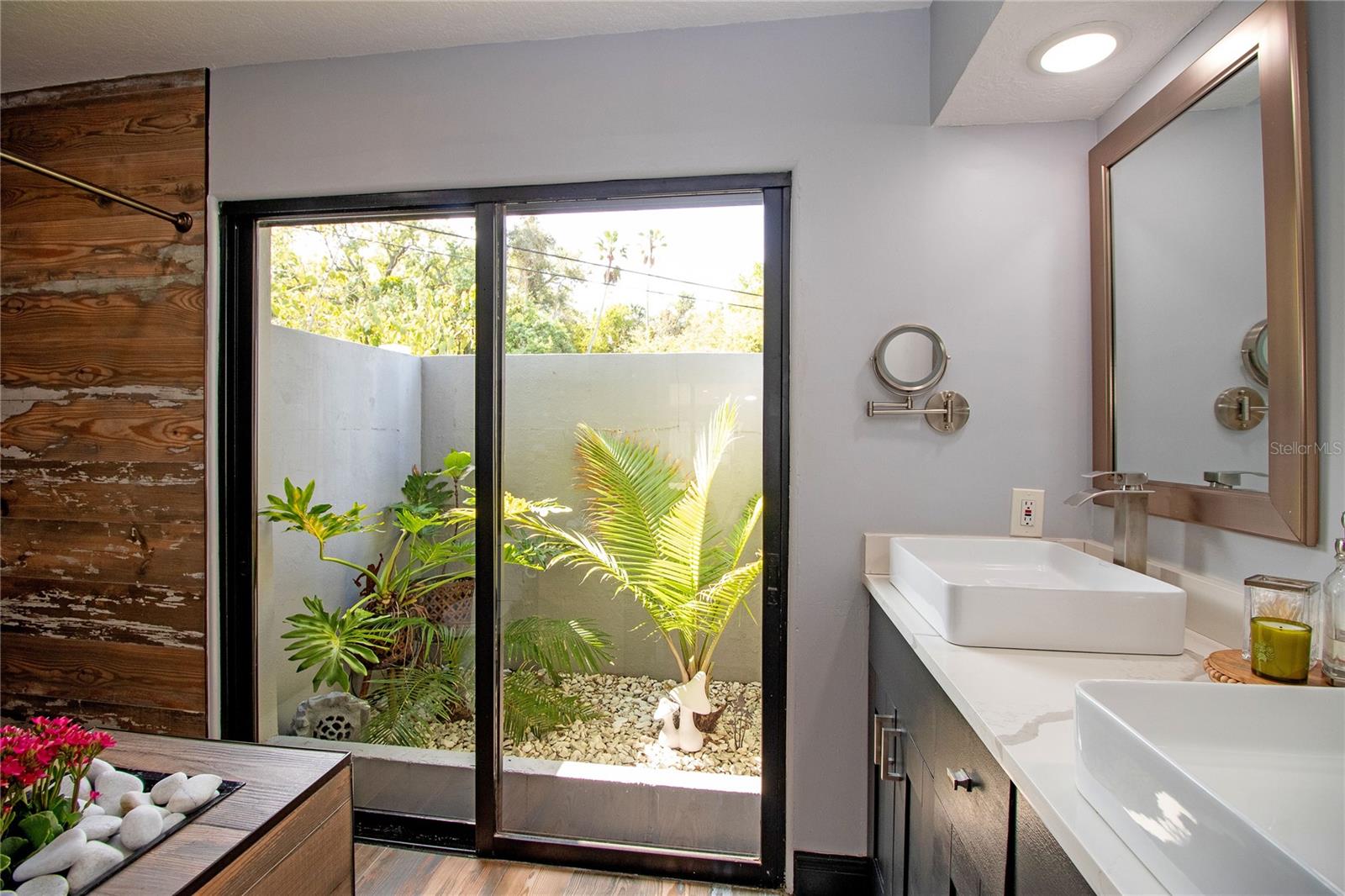 This bath is a vibe with that garden space.