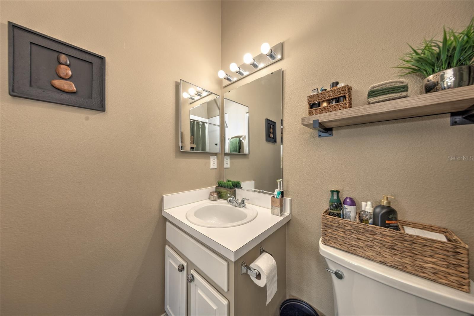 primary bathroom includes full bath tub/shower and vaulted ceilings