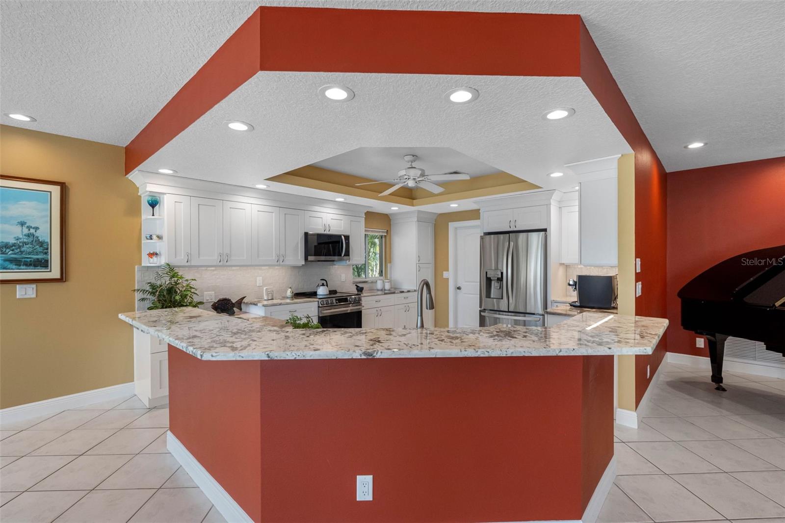 Granite bar with room for plenty of stools.