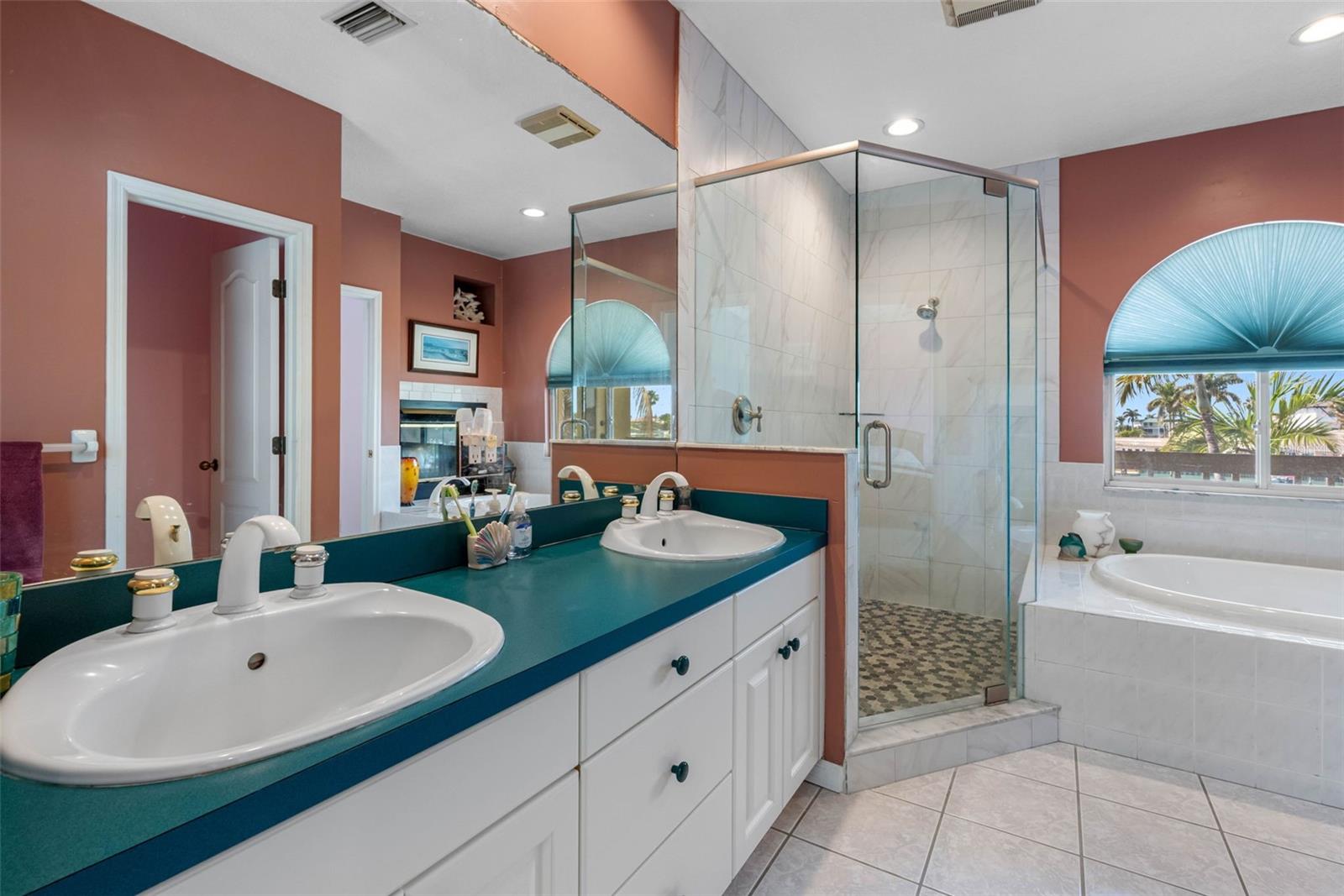 Double sinks and walk-in shower.