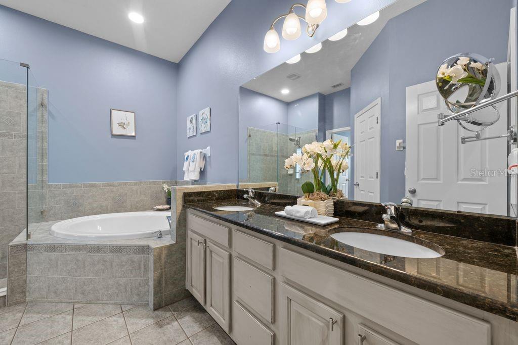 Primary bathroom with dual sinks and soaking tub