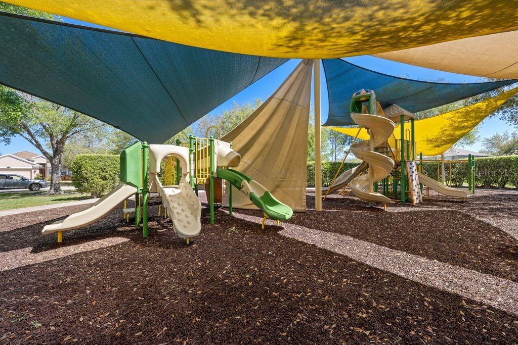 Community amenities including courts, playground, and green spaces