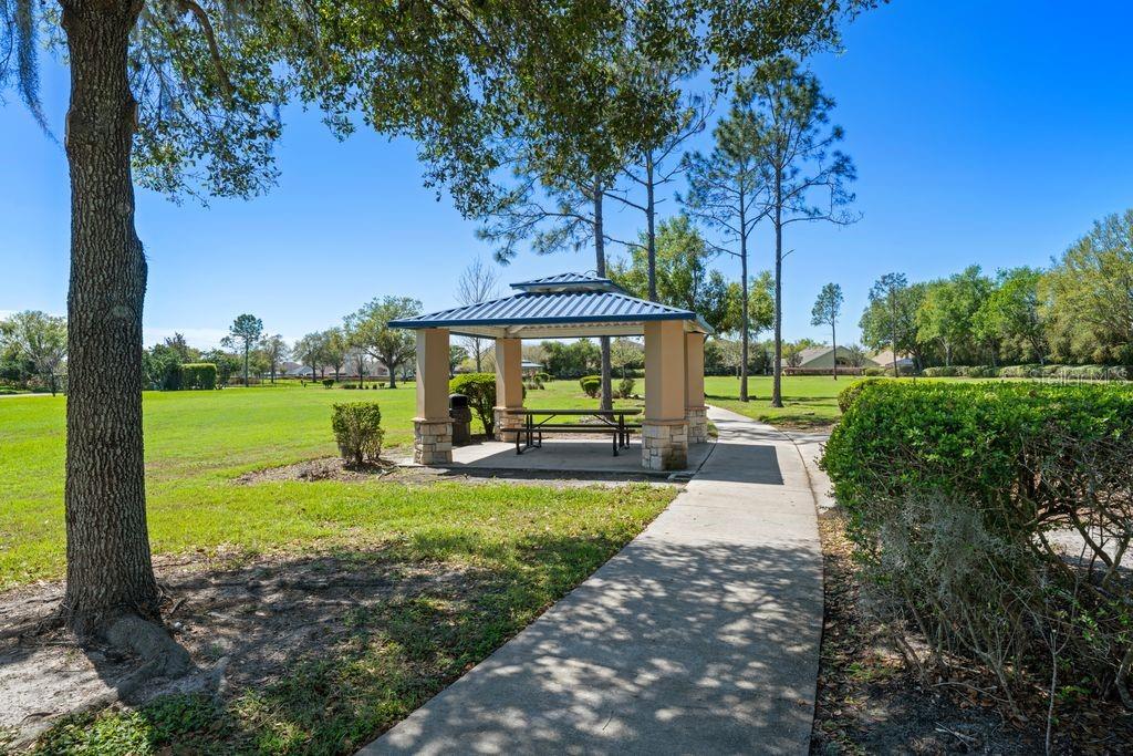 Community amenities including courts, playground, and green spaces