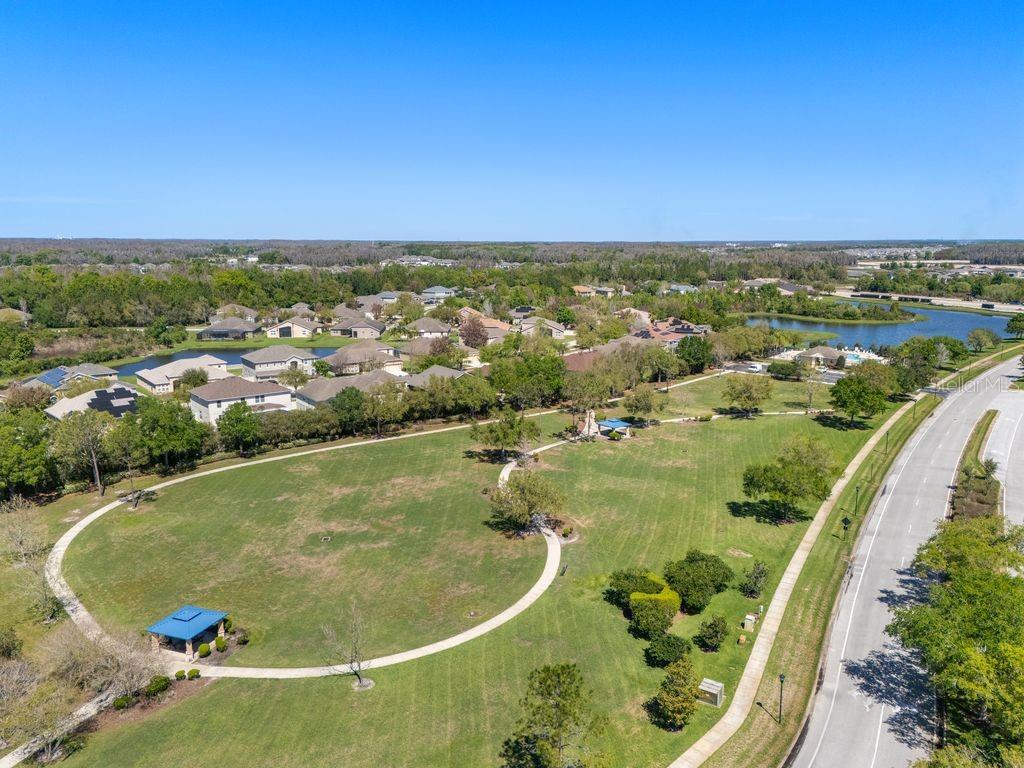 Community amenities including courts, playground, and green spaces