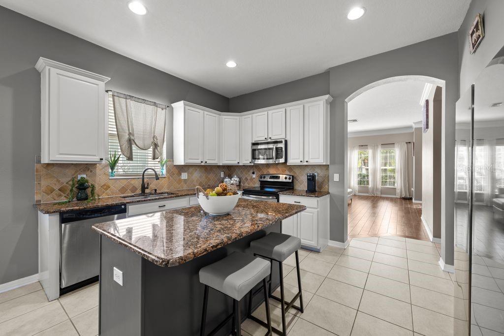 Updated kitchen with center island and ample cabinetry