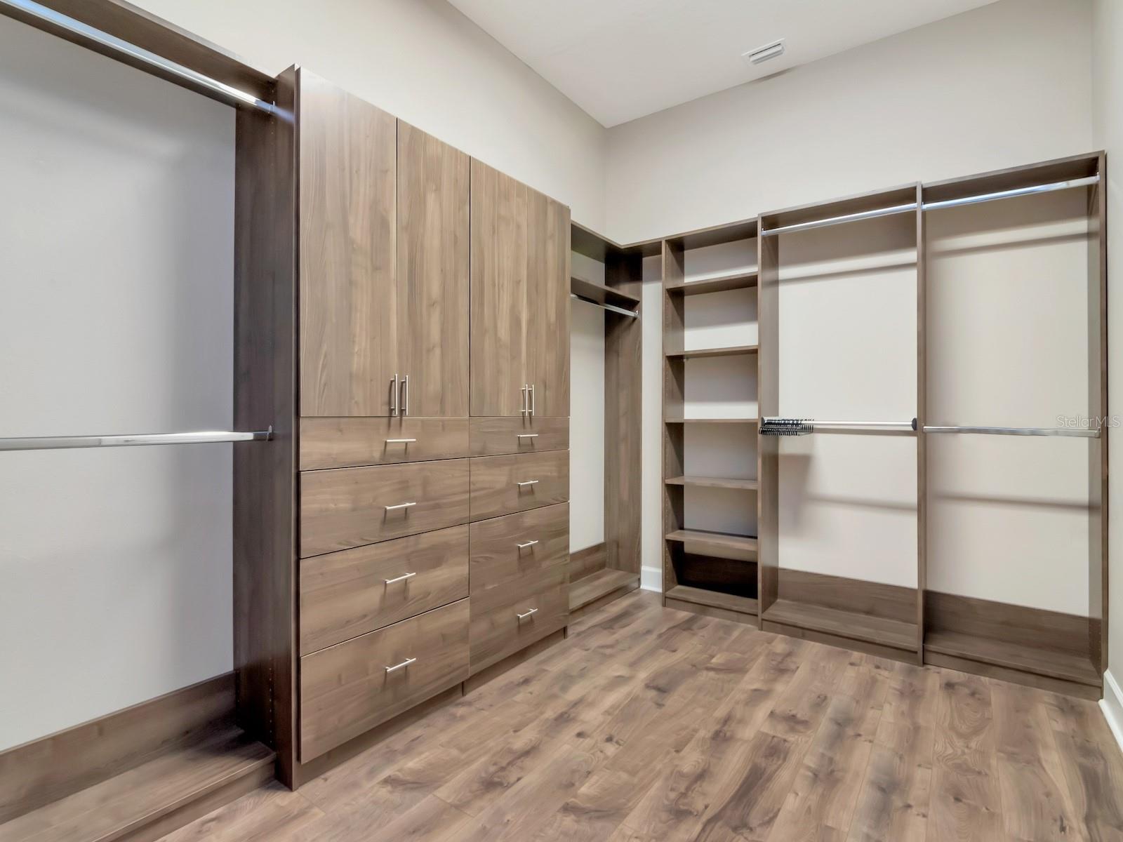 Primary closet with custom closets