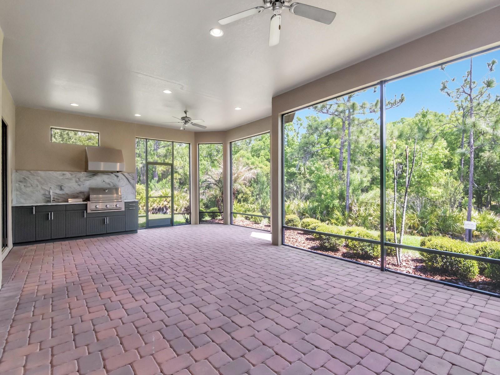 Extended patio with outdoor kitchen