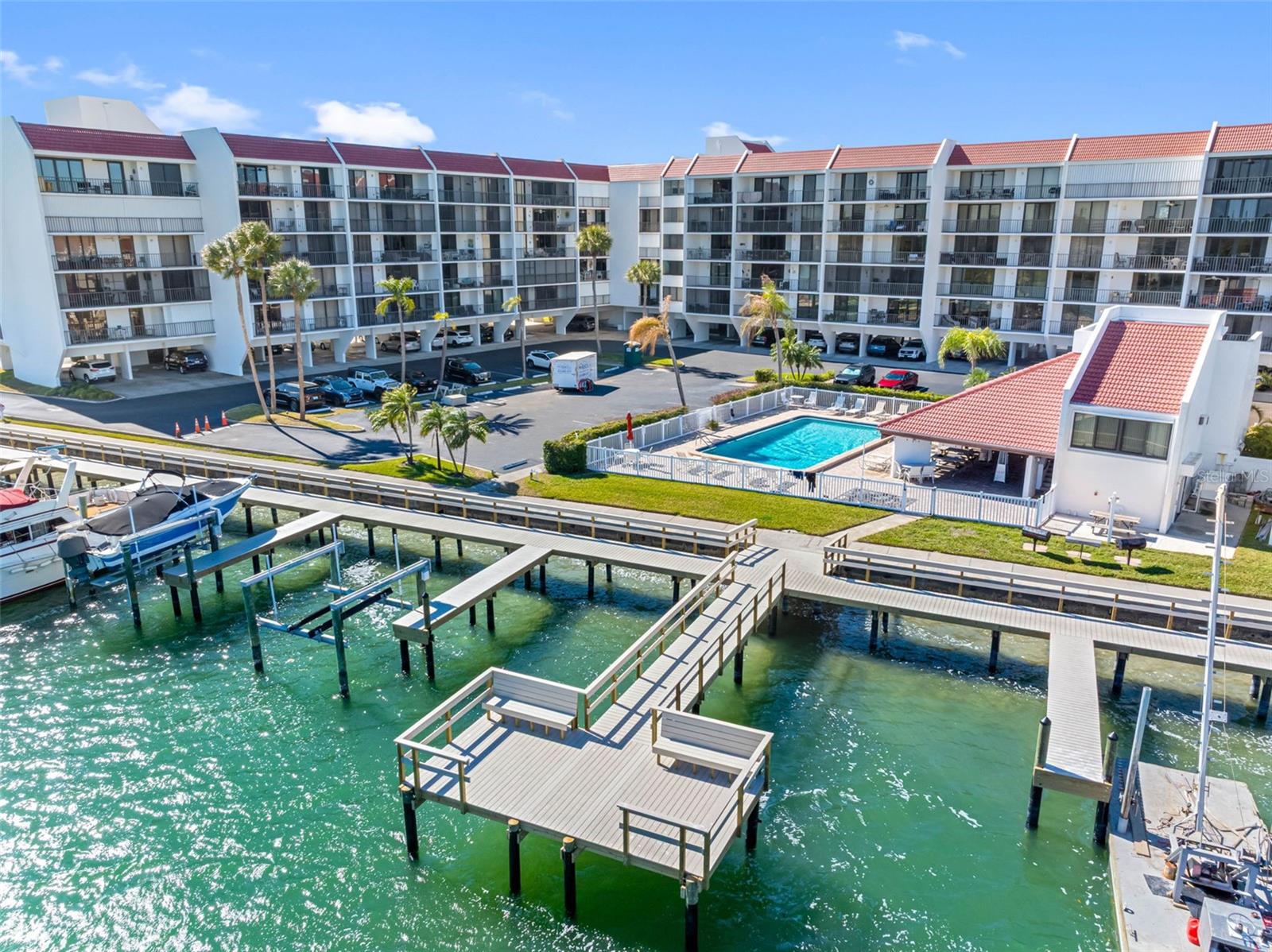 .. Nice Photo of  NEW 500 Foot Promenade- Boat Slips  - Day Dock - Fishing Dock .. Heated Pool & Covered Lounging Area. On site Managers Office ( Red Roof ).