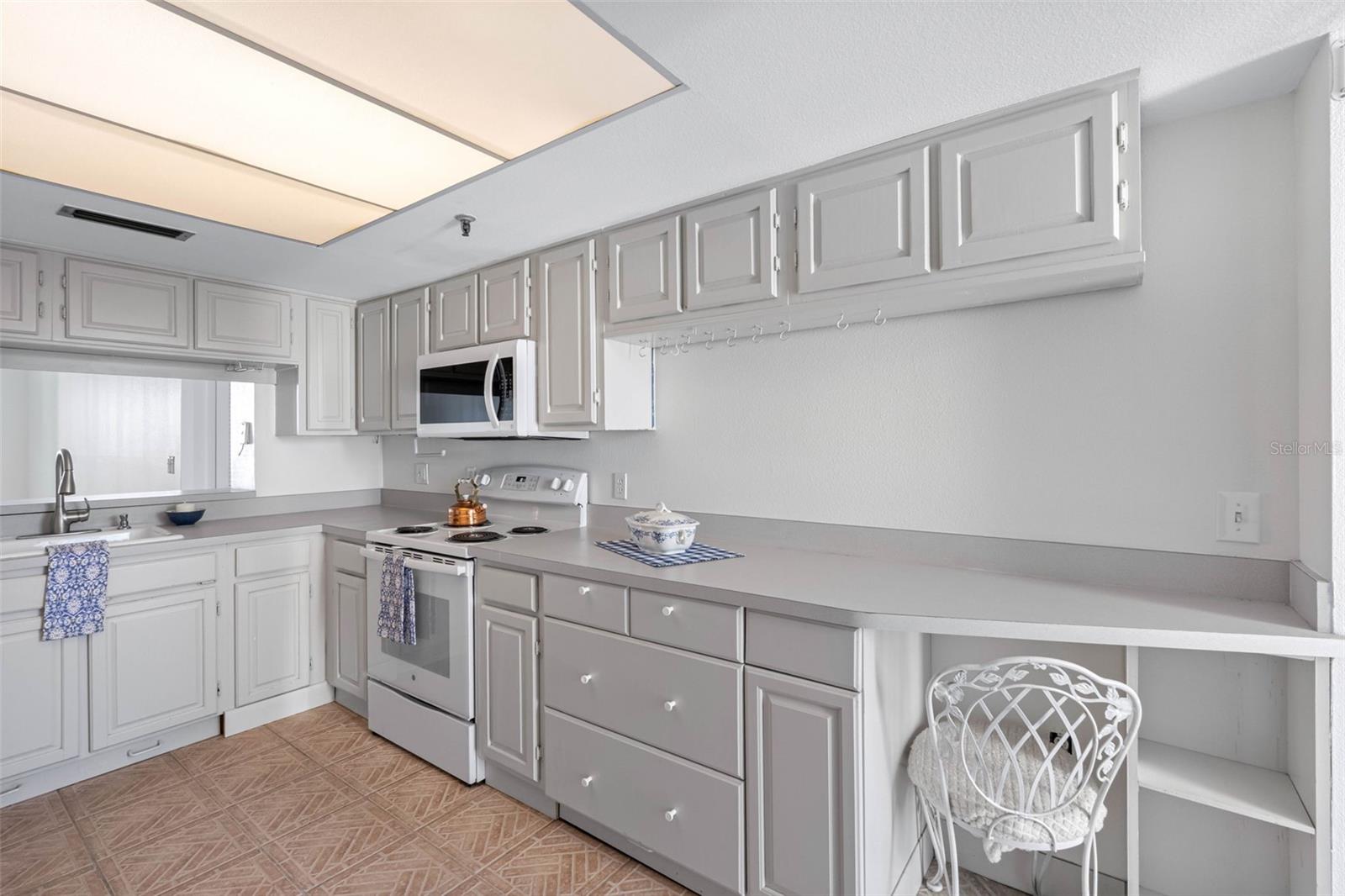 ... Kitchen Looking out towards Large Living Room & Dining Area..PLenty of Cabinet Space.