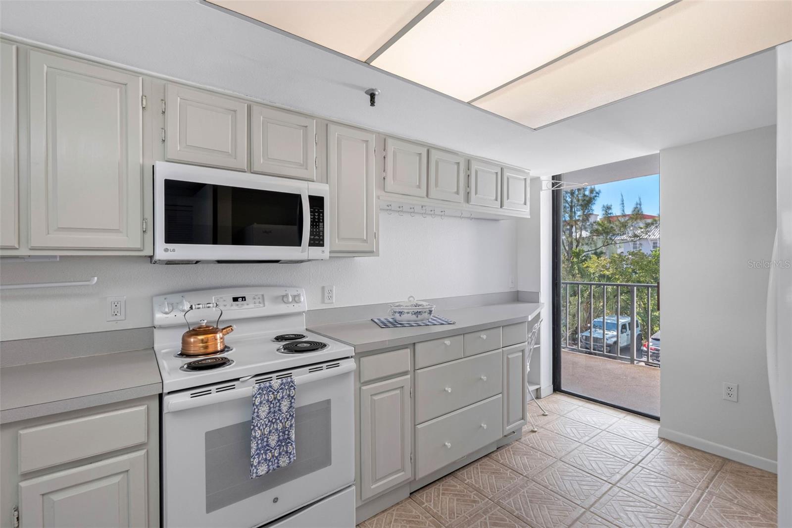 ... Kitchen Looking Towards West Balcony. The West Side 18 Foot Balcony can be accessed from Both Kiitchen & Guest Bedroom.